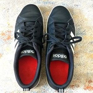 Black Adidas with white stripes. Size 11.